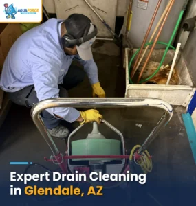 plumber cleaning a drain
